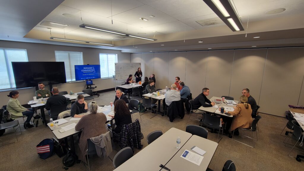  /><figcaption><em>Conference participants work together in small group sessions to brainstorm economic resilience implementation plans. Photo: Brett Schwartz.</em></figcaption></figure>
<p><!-- /wp:image --></p>
<p><!-- wp:heading {