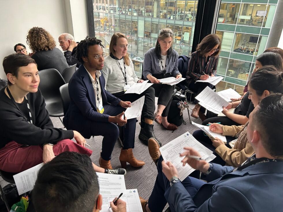 A group of people sitting in a circle