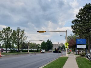A beacon with a pedestrian crossing sign will flash when cars need to yield for pedestrians