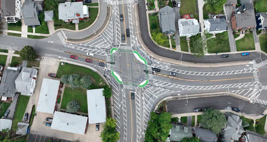 Freshly painted crosswalks, bumpouts, and bike lanes help create a buffer for pedestrians and cyclists and slow vehicle travel