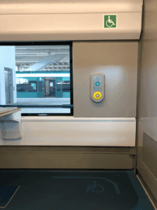 Space for wheelchairs on Tren Maya. A station elevator is visible through the window.