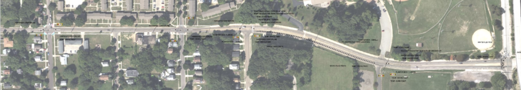  Aerial photo of a three-way intersection with labels marking planned safety improvements, including pedestrian crosswalks, curb ramps, planter boxes, flex posts and painted curb extensions.